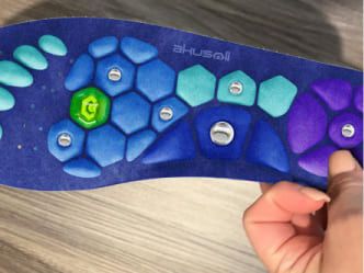 Akusoli insole close-up showing acupressure points
